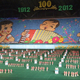 Illustration for article titled The Amazing, Colorful Flip Card Propaganda Mosaics of North Korea